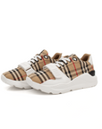 Gold & Beyond Burberry Check trainers, stylish shoes with classic check pattern and white rubber soles, casual footwear for men and women.