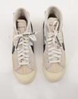 Nike x Off-White Blazer shoes in white with signature design details, displayed on a neutral background.