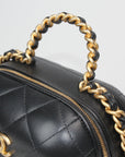 Chanel Matelassé Vanity Shoulder Bag in quilted black leather with gold-tone hardware and a stylish chain strap.