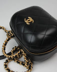 Chanel Matelassé Vanity Shoulder Bag in black leather with quilted design and gold-tone chain strap.