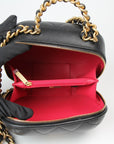Chanel Matelassé Vanity Shoulder Bag in black leather with quilted design and gold chain strap, showcasing elegant craftsmanship.