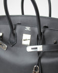 Hermès Birkin 35 handbag in classic design with leather finish, showcasing its elegant shape and gold hardware accents.