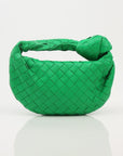 Bottega Veneta Mini Jodie Bag in soft leather, showcasing its unique woven design and compact size for stylish carry.