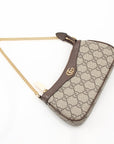 Gucci Ophidia GG Supreme Canvas Bag featuring signature GG logo and classic handbag design in a stylish setting.