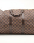 Louis Vuitton Keepall 50 Damier Ebene duffle bag with leather trim, zipper closure, and carry handles for travel.