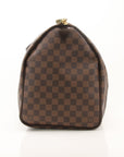 Louis Vuitton Keepall 50 Damier Ebene duffle bag with leather trim, spacious travel bag from Gold & Beyond.