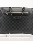 Gold & Beyond Louis Vuitton Porte-Documents Voya briefcase for travel, featuring brown monogram canvas and leather accents.