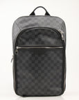Louis Vuitton Michael backpack in black travel bag with leather accents, featuring multiple compartments and adjustable straps.