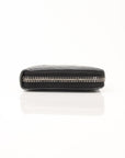 Yves Saint Laurent Chevron Wallet in black leather with a quilted chevron pattern and gold-tone hardware.