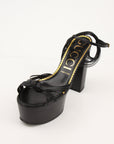 Gold & Beyond Gucci Knot platform sandals with heels, featuring stylish straps and a sleek design.