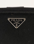 Gold & Beyond Prada zip wallet with sleek design and multiple card slots, shown in black leather on a plain background.