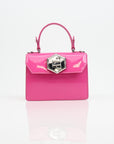 Pink patent Philipp Plein top handle handbag with gold accents, stylish and luxurious for everyday or evening use.