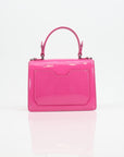 Pink patent top handle handbag by Philipp Plein featuring gold accents and structured design.