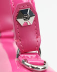 Pink patent top handle handbag by Philipp Plein with gold accents, featuring a sleek and stylish design.