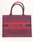 Christian Dior Book Tote handbag featuring intricate heart embroidery on a stylish design by Gold & Beyond.