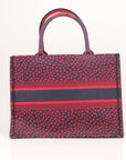 Christian Dior Book Tote handbag featuring intricate heart embroidery, showcasing a stylish and elegant design.