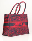 Christian Dior Book Tote handbag featuring vibrant heart embroidery, showcasing a stylish design and luxury craftsmanship.