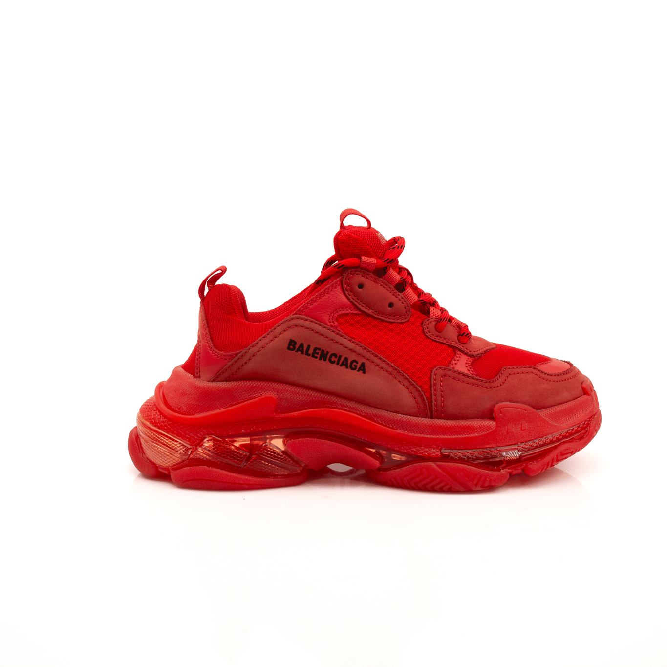 Gold & Beyond Balenciaga Triple S sneakers in white and beige with chunky sole and sporty design.