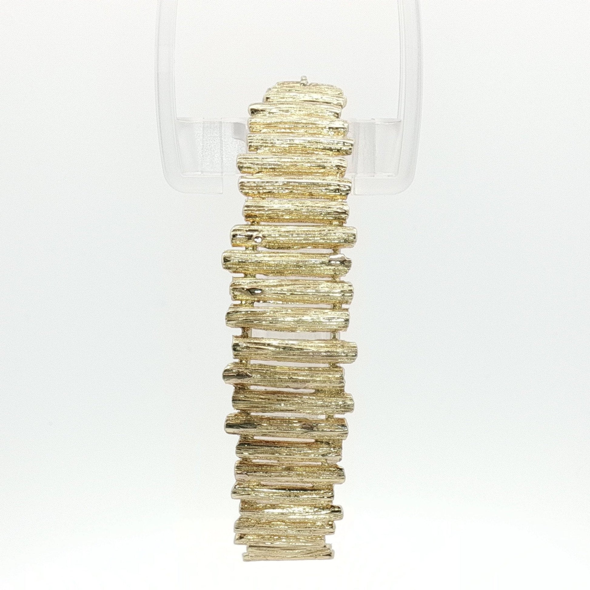 14K yellow gold brutalist textured bangle bracelet with modern, artistic design showcasing bold, rugged jewelry style.