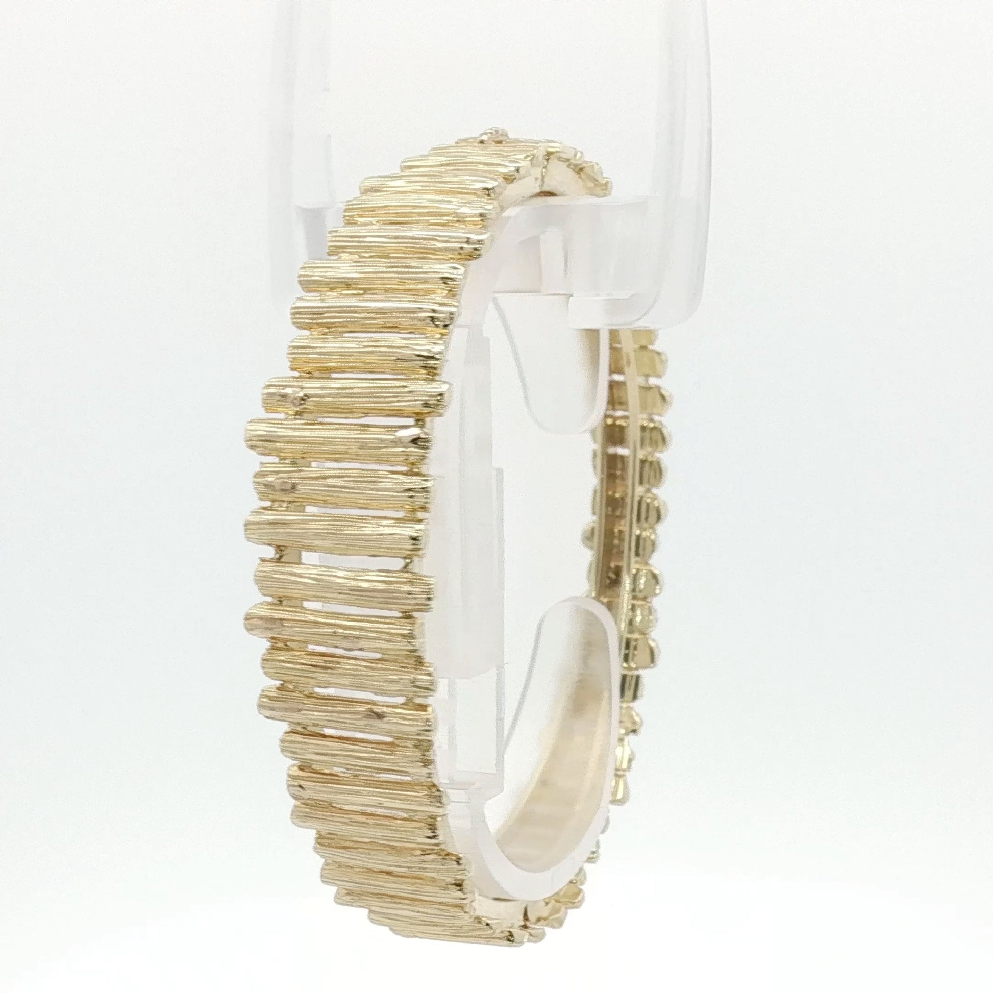14K yellow gold brutalist textured bangle bracelet with bold, artistic design from Gold & Beyond jewelry collection.