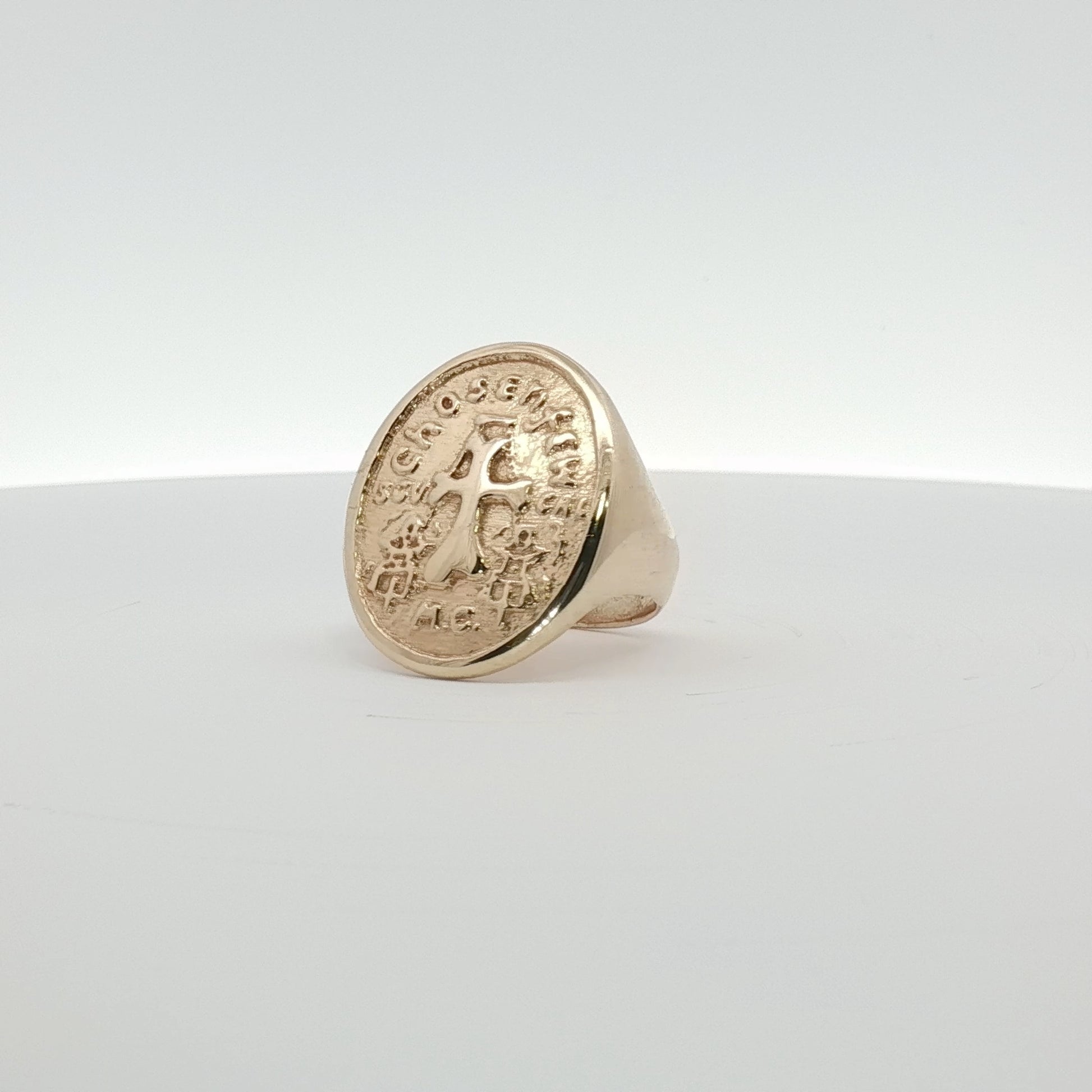 14K yellow gold cross coin ring featuring intricate design, jewelry piece by Gold & Beyond with detailed craftsmanship.