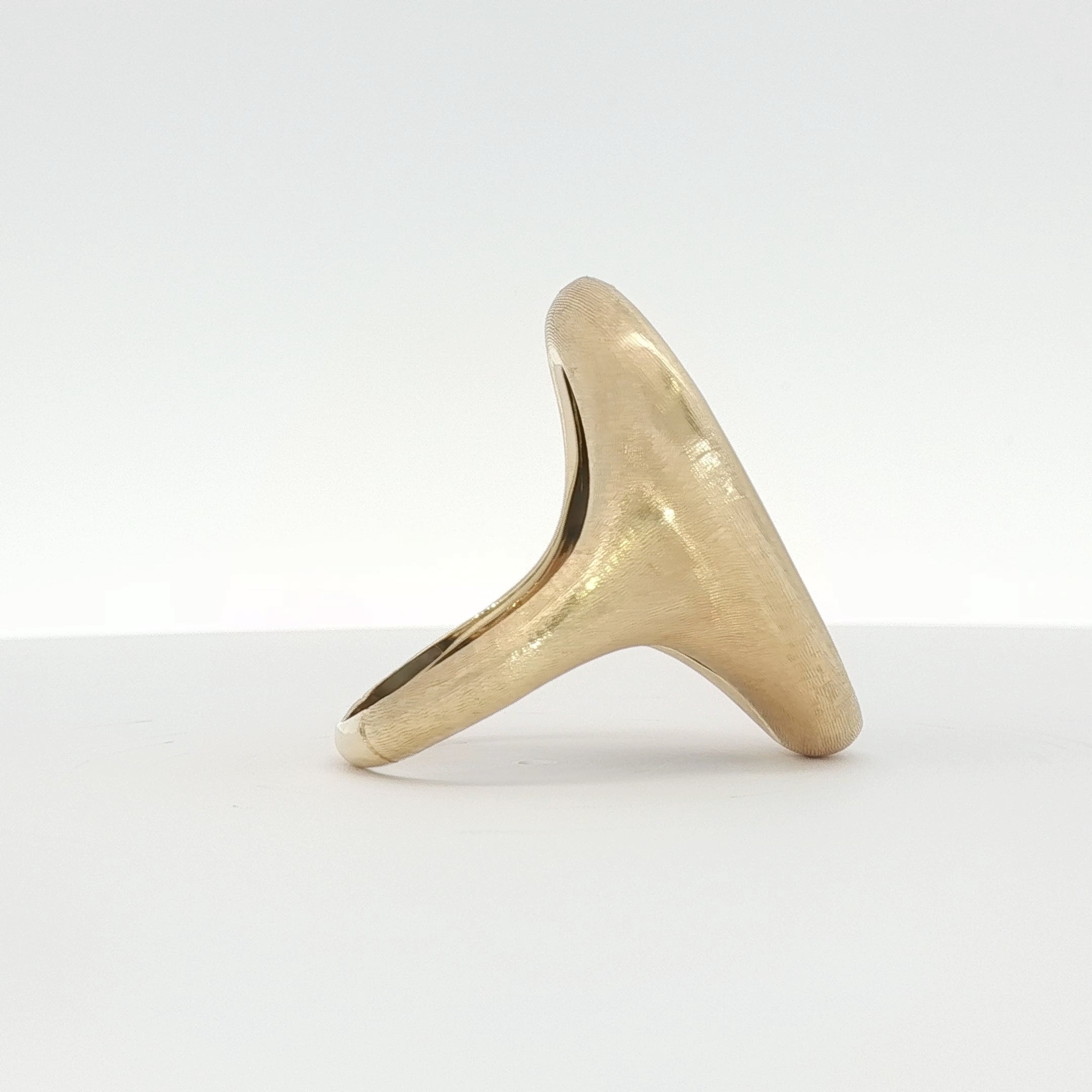 18K yellow gold Marco Bicego Lunaria ring with black mother of pearl, showcasing intricate jewelry design on a gold and beyond store image.