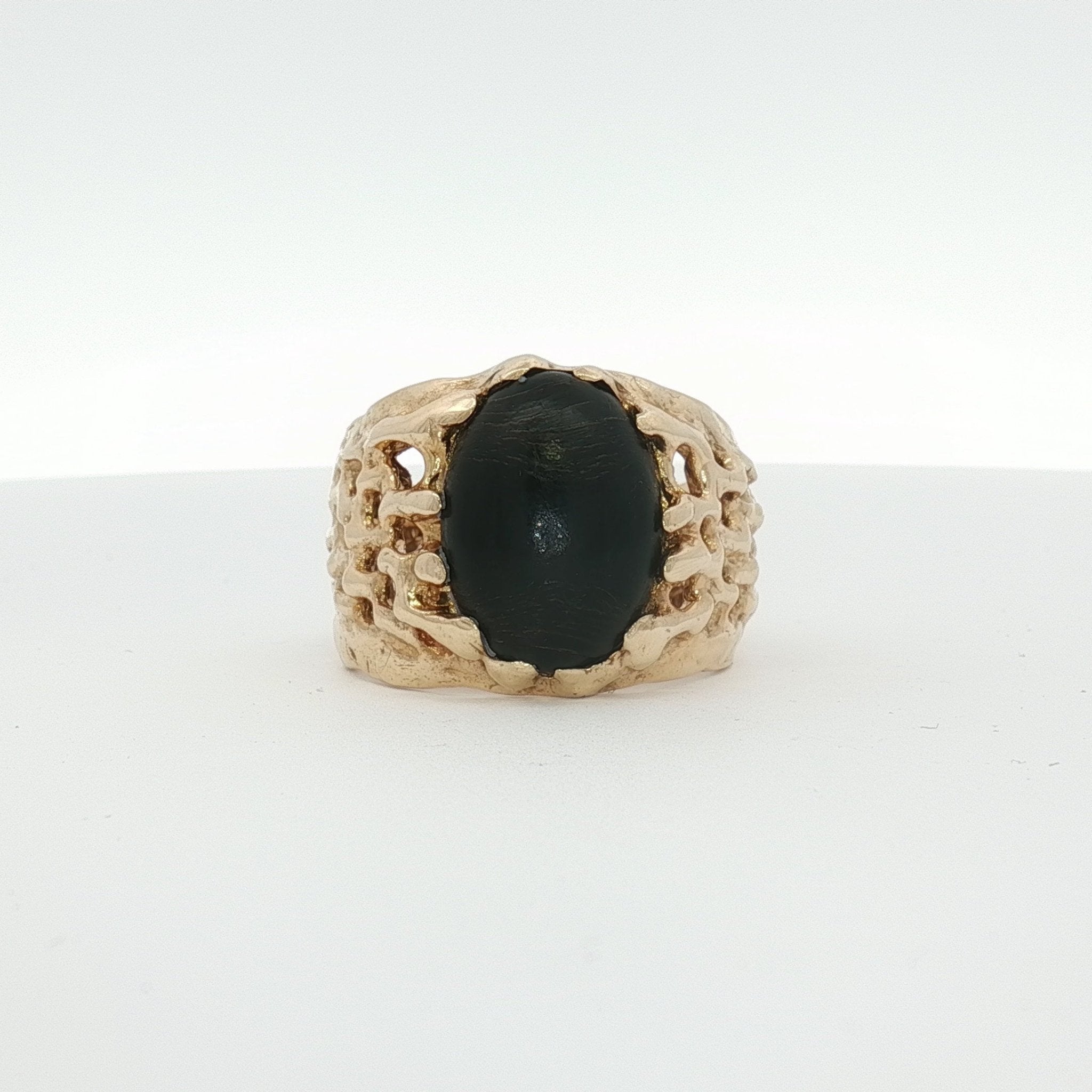 14K yellow gold nugget ring featuring an oval black stone, crafted by Gold & Beyond, elegant jewelry accessory.