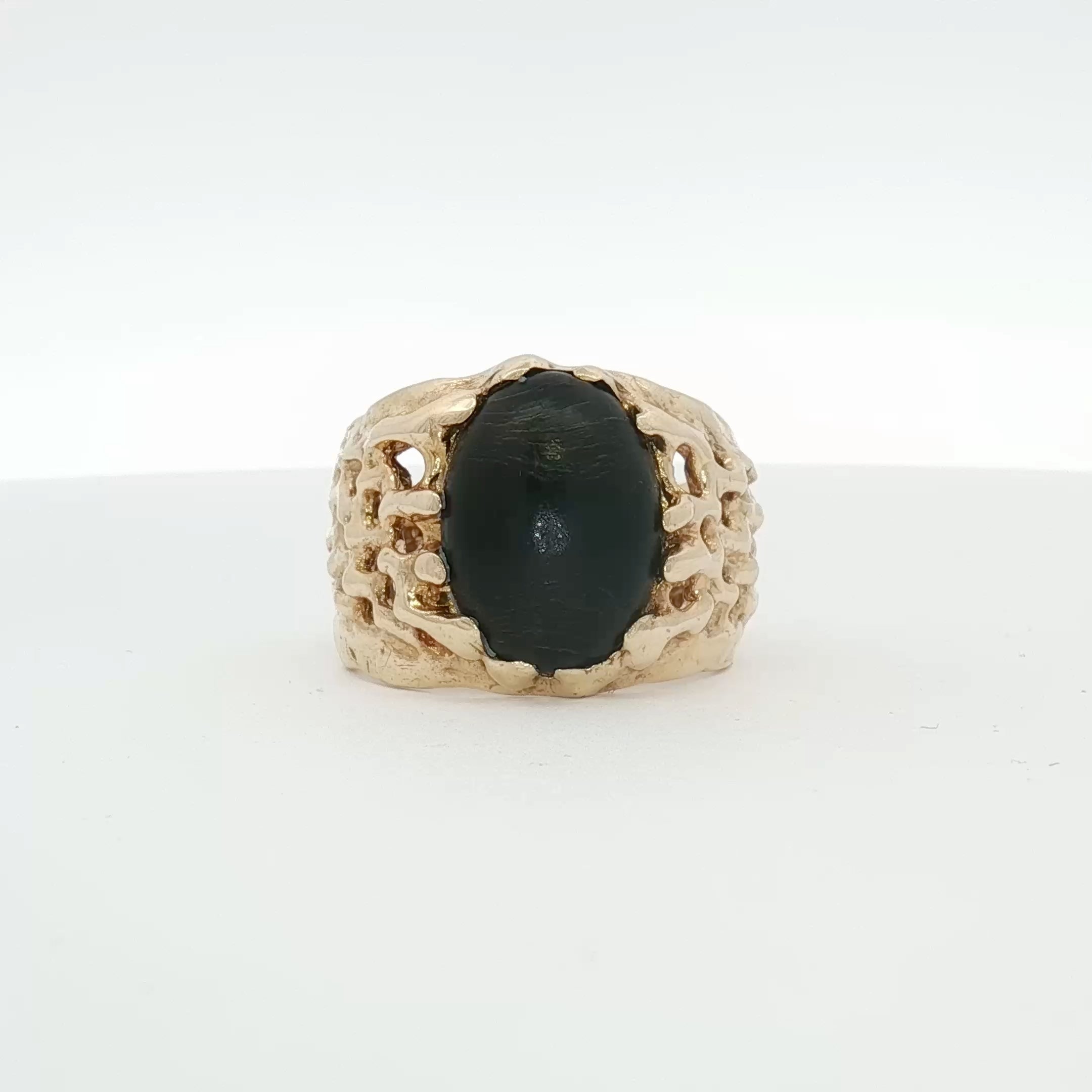 14K yellow gold nugget ring featuring a smooth oval black stone, elegant jewelry piece from Gold & Beyond.