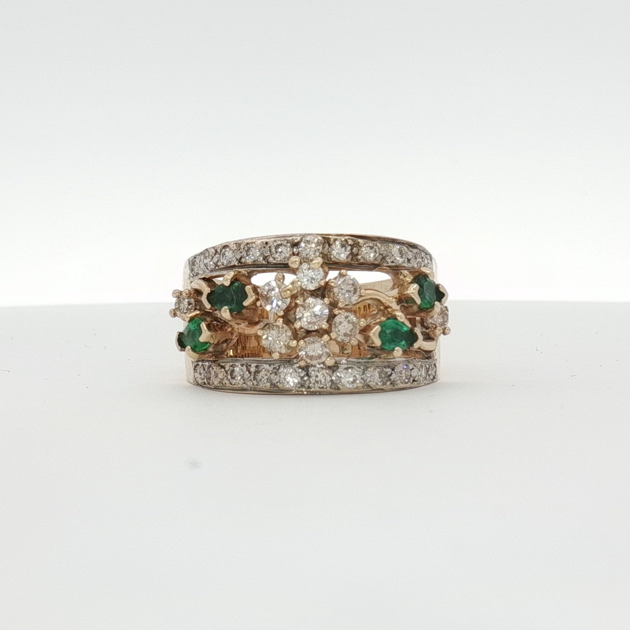 10K yellow gold emerald and diamond flower cluster ring, jewelry featuring vibrant green emeralds and sparkling diamonds.