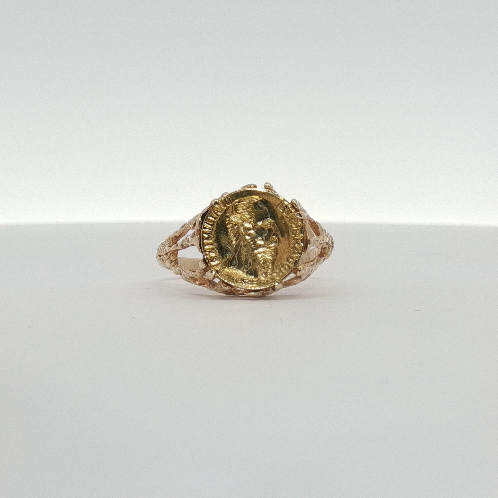 14K yellow gold coin ring from Gold & Beyond, featuring a detailed coin design on a sleek jewelry band.