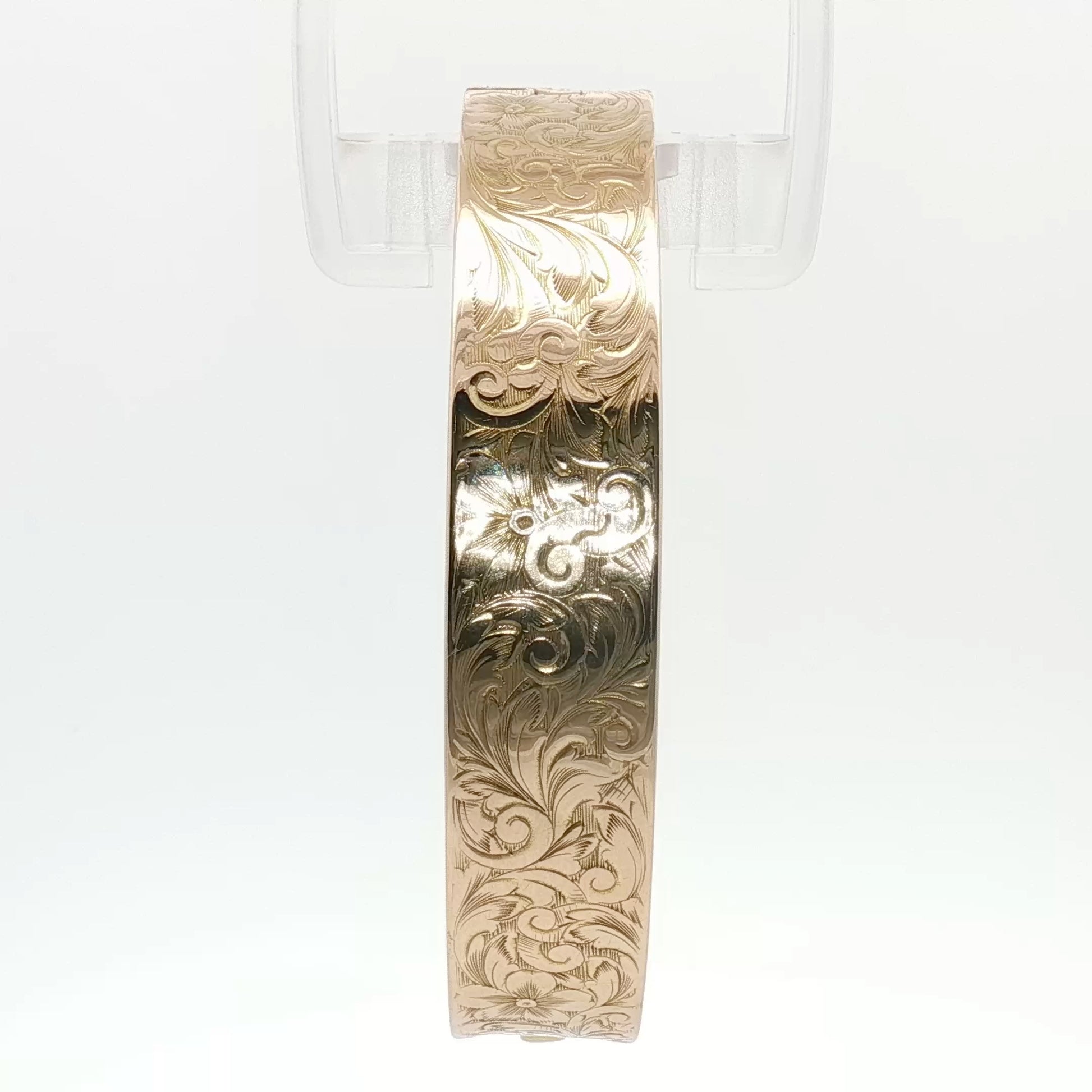 14K yellow gold engraved floral bangle bracelet with intricate floral design, jewelry piece from Gold & Beyond.