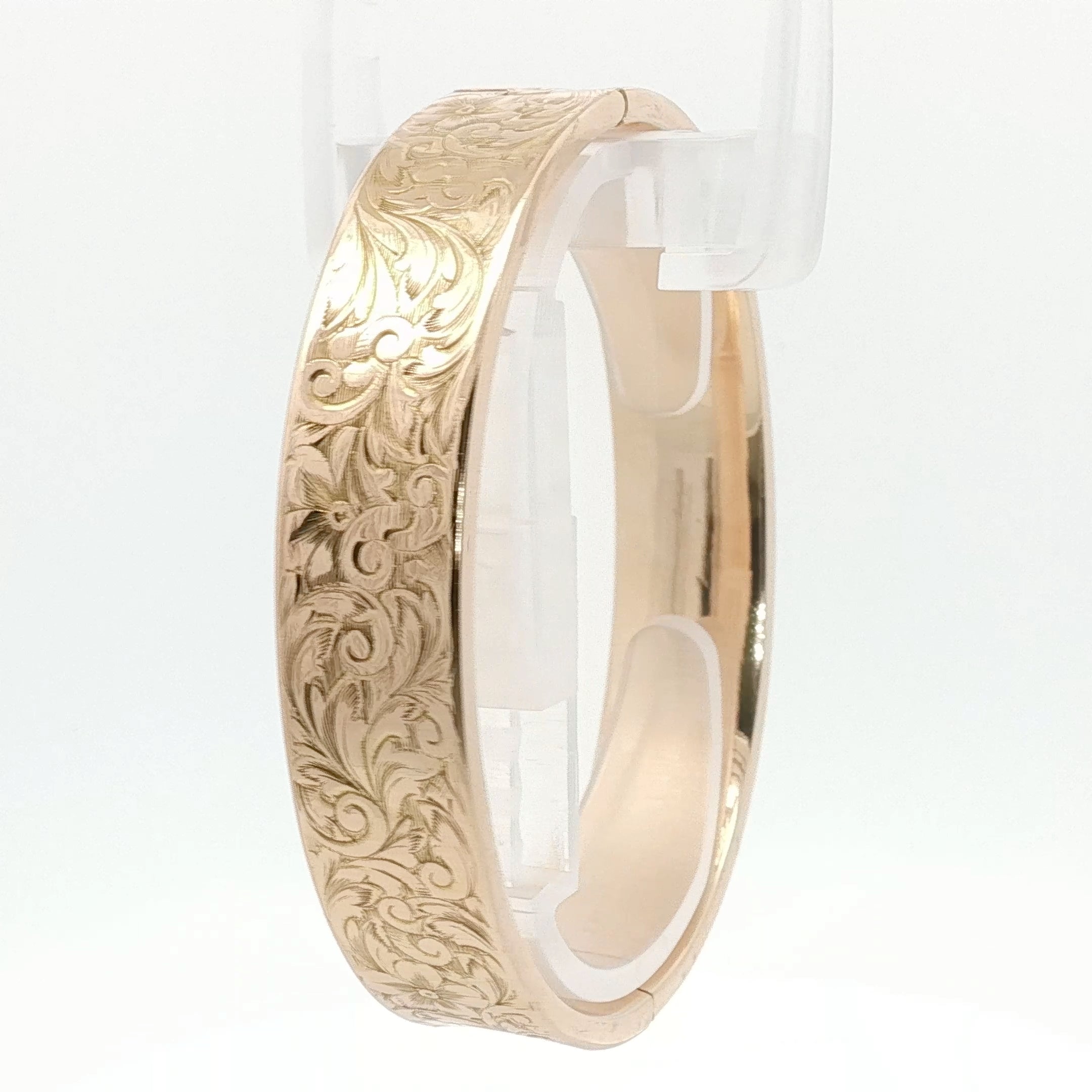 14K yellow gold engraved floral bangle bracelet, jewelry piece with detailed floral design from Gold & Beyond
