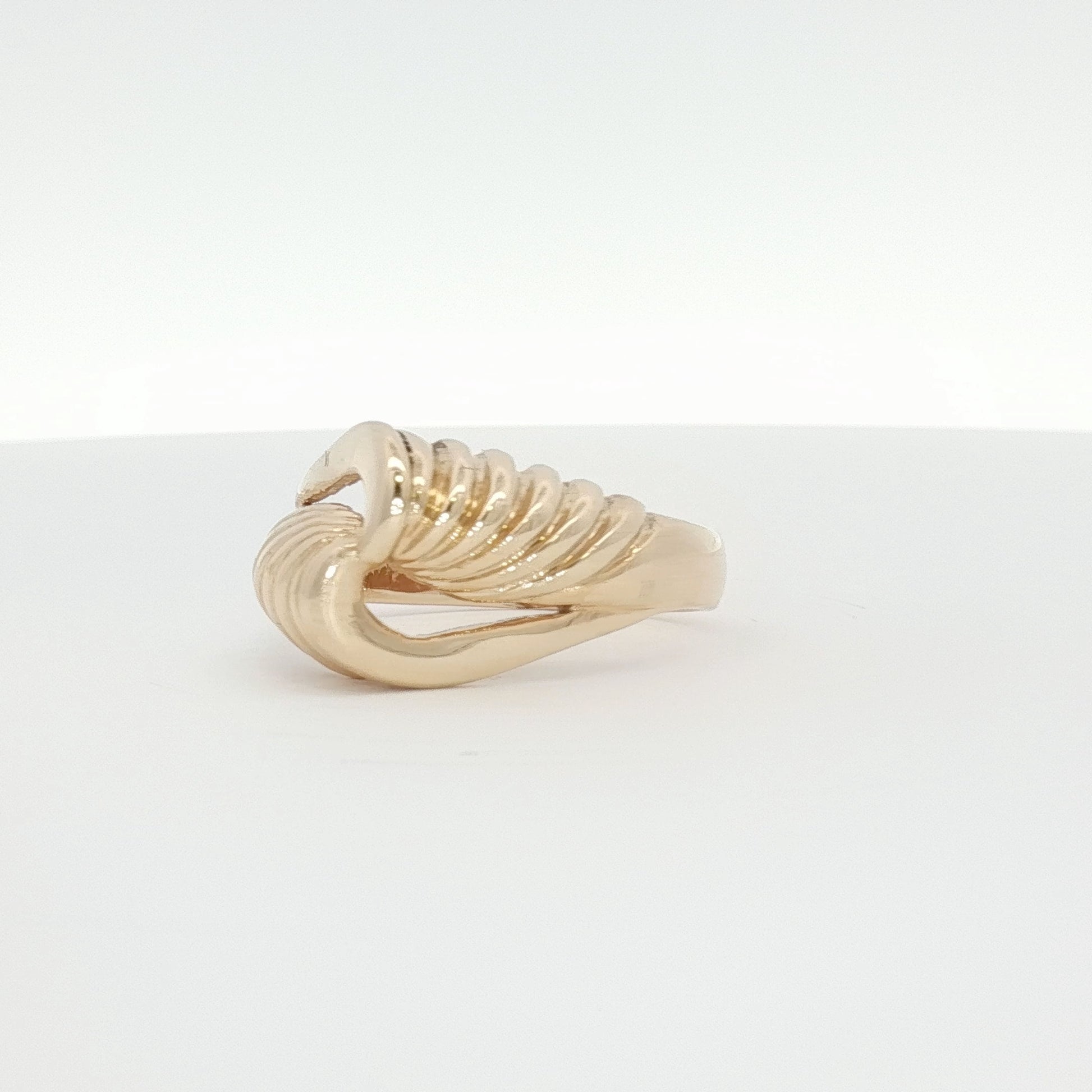 14K yellow gold swirl cluster ring with intricate design, showcasing sparkling gemstone accents in a close-up view.