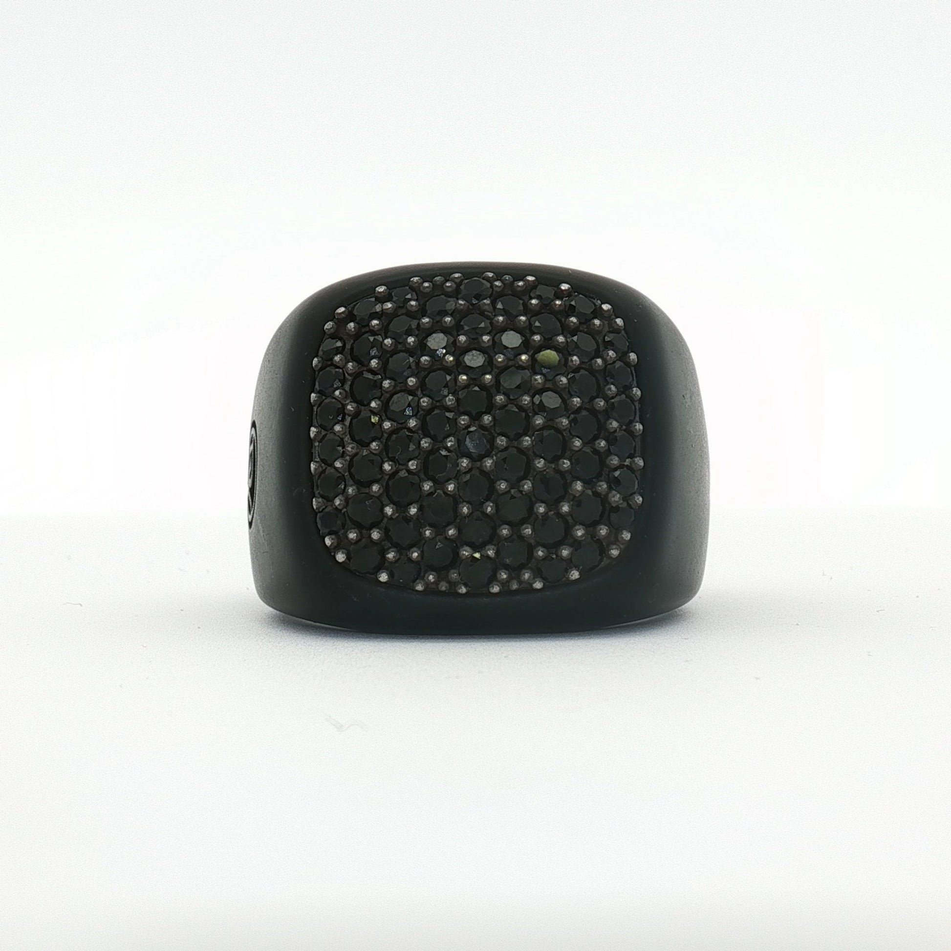 Black diamond signet ring from David Yurman jewelry collection, featuring a sleek design and polished finish.