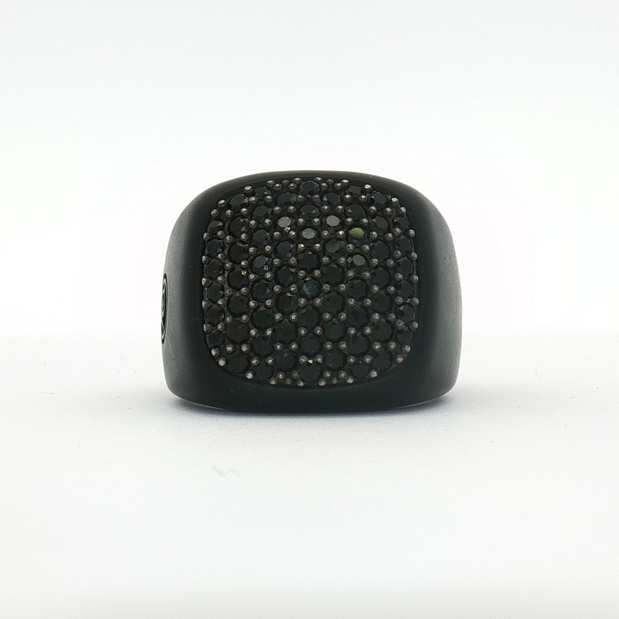 Black diamond signet ring from David Yurman jewelry collection, featuring a sleek design and polished finish.