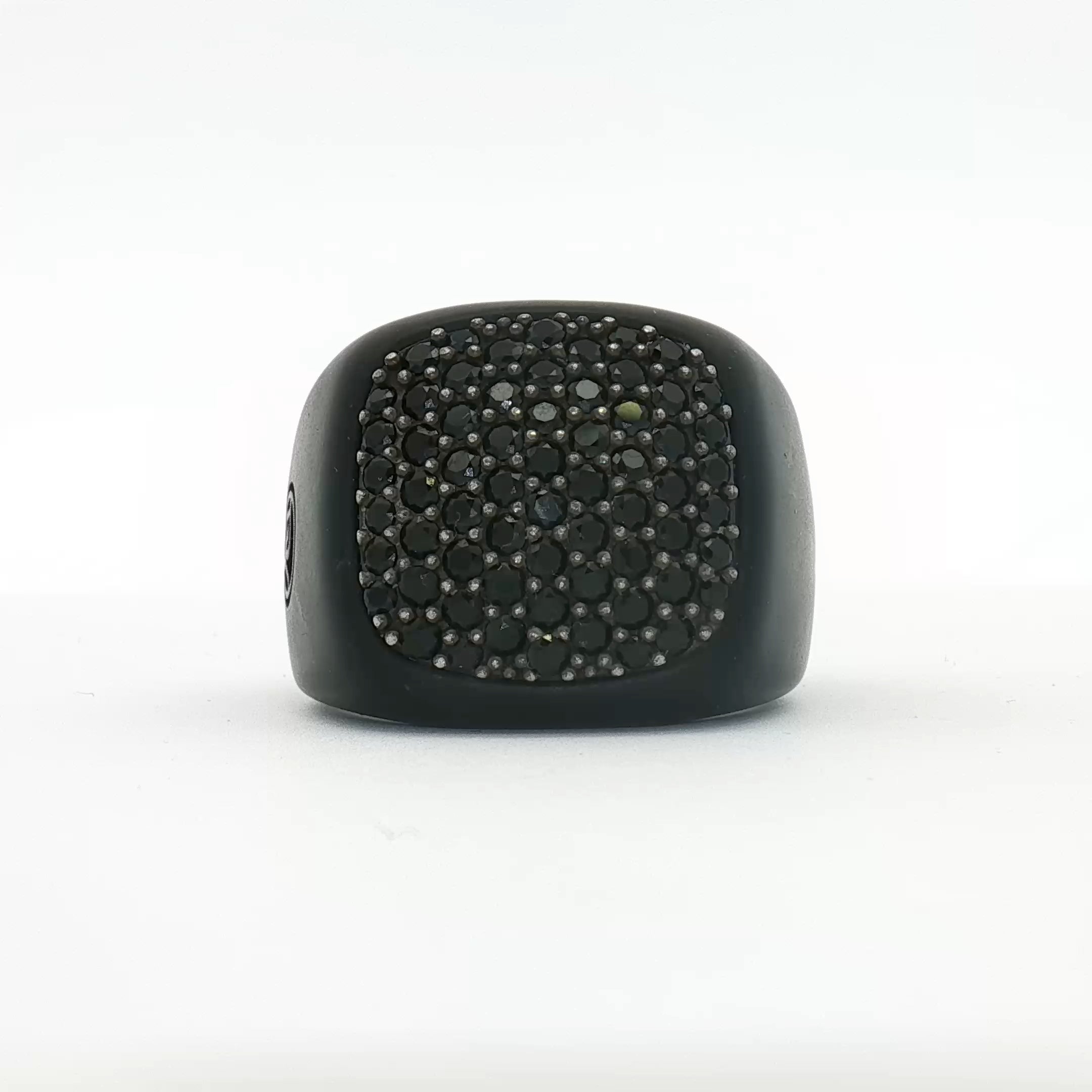 Black diamond signet ring from David Yurman jewelry collection, featuring a sleek design and polished finish.
