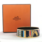 Hermès enamel bangle bracelet with colorful design, jewelry by Gold & Beyond, showcasing vibrant enamel details and sleek gold accents.