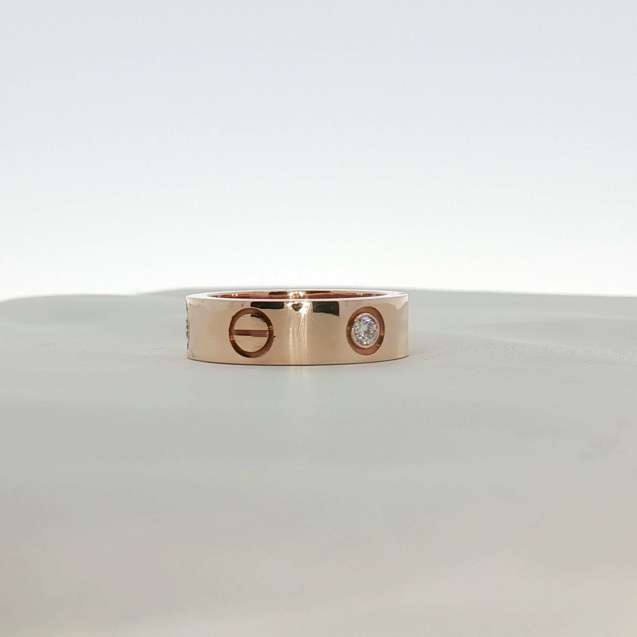 Cartier Love diamond ring showing a gold band with embedded diamonds, elegant jewelry piece from Gold & Beyond.