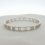 Gold & Beyond Tiffany & Co. Atlas open cuff bracelet featuring sleek, modern jewelry design with engraved detailing.