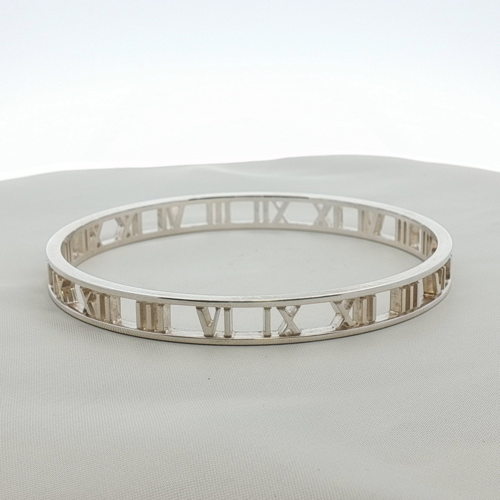 Gold & Beyond Tiffany & Co. Atlas open cuff bracelet featuring sleek, modern jewelry design with engraved detailing.