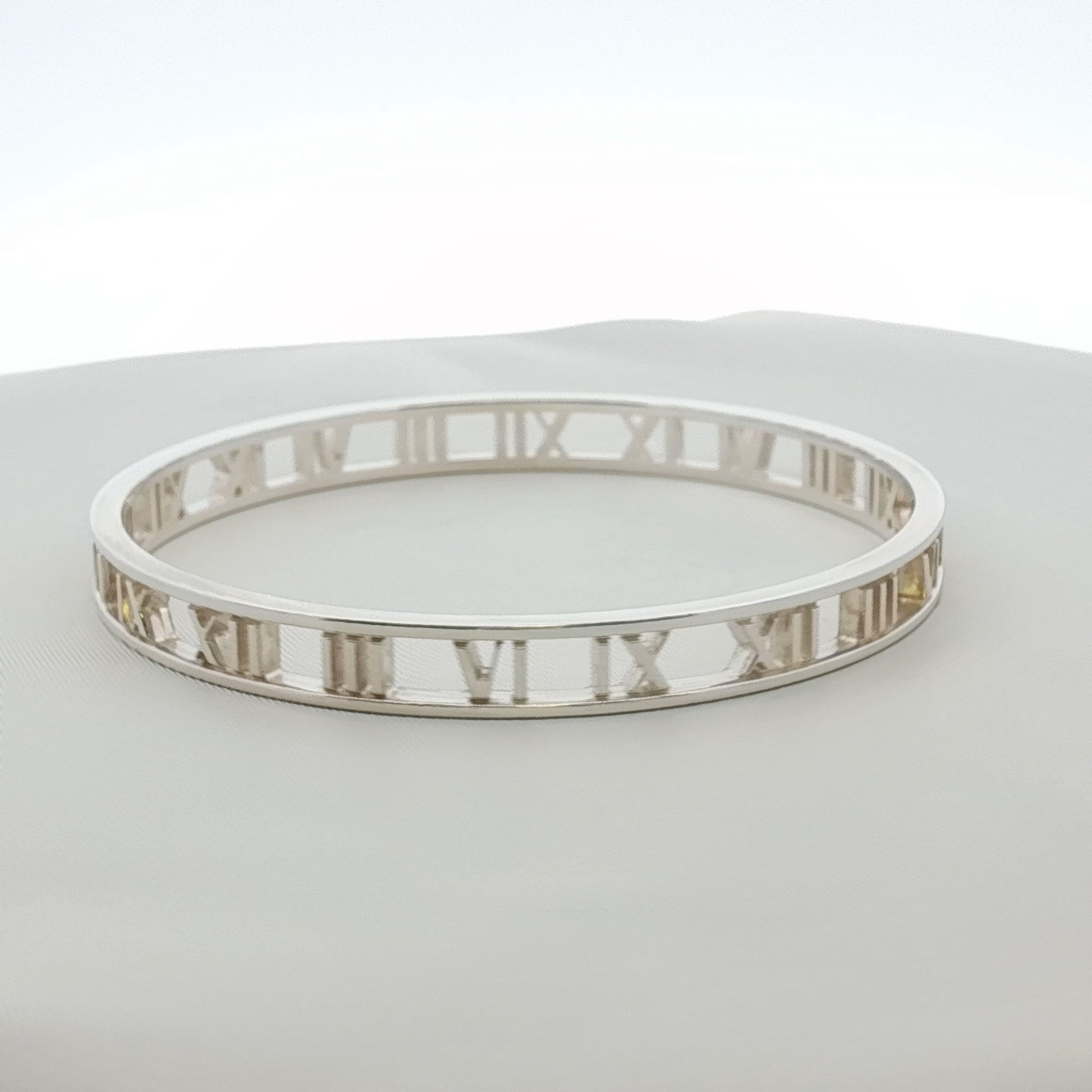 Gold & Beyond Tiffany & Co. Atlas open cuff bracelet with sleek gold jewelry design on a white background