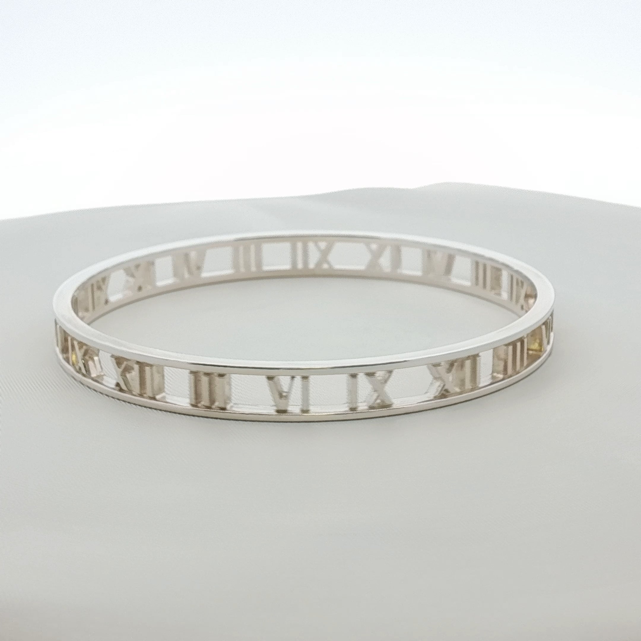 Gold & Beyond Tiffany & Co. Atlas open cuff bracelet with sleek gold jewelry design on a white background