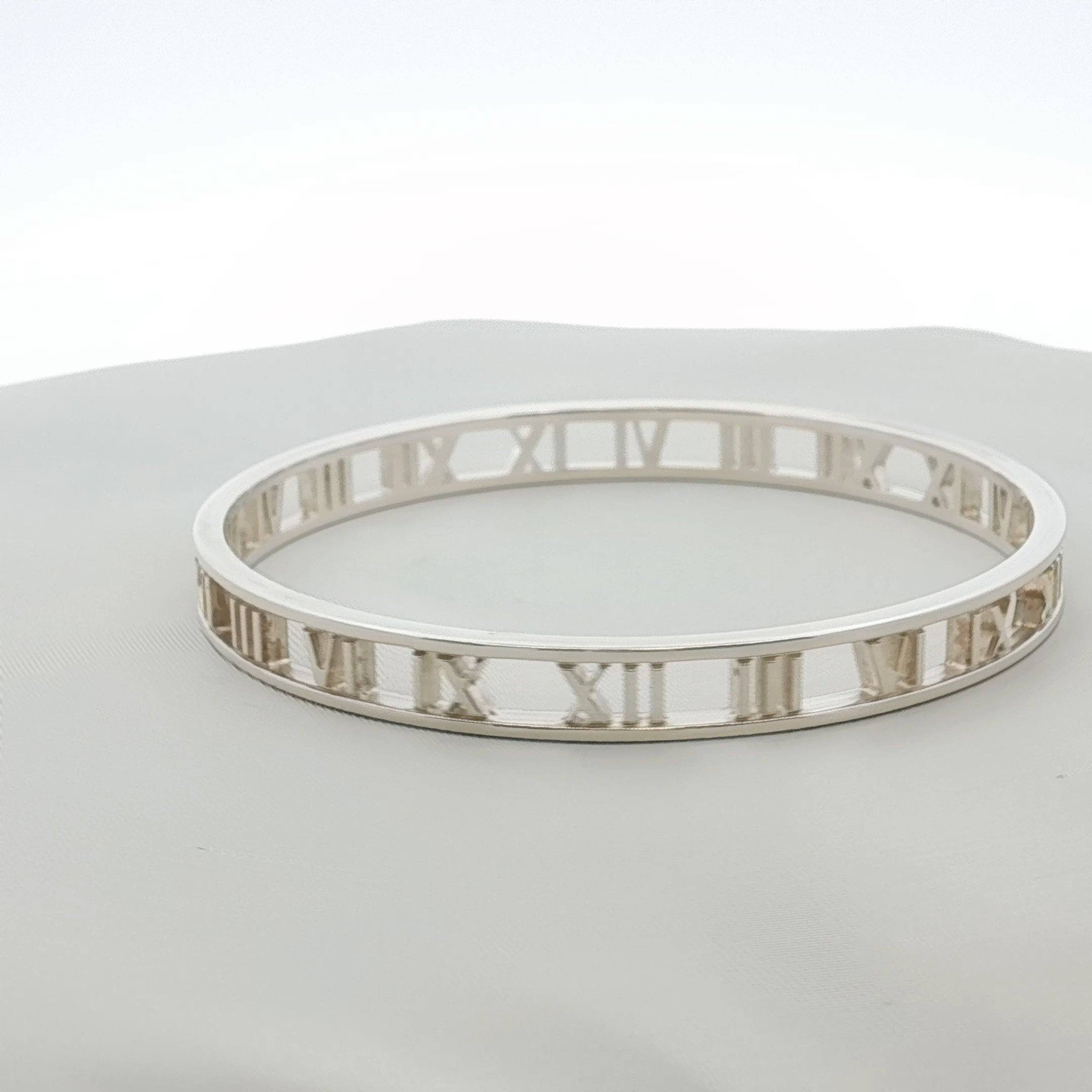 Gold & Beyond Tiffany & Co. Atlas Open Cuff Bracelet in jewelry, featuring a sleek gold design with engraved details.