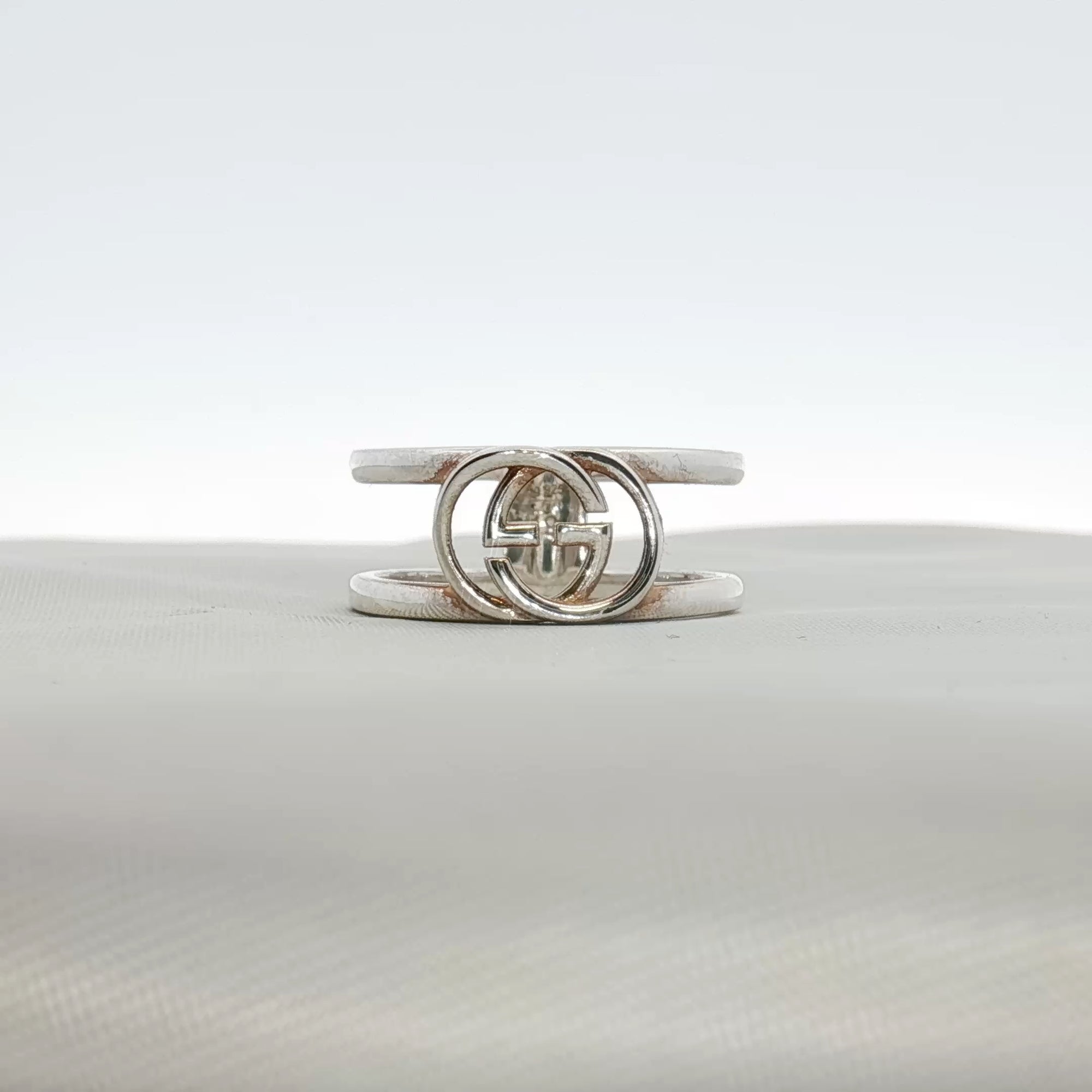 Sterling silver Gucci GG ring featuring the iconic logo design, crafted for elegant jewelry wear.