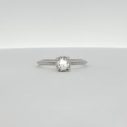 14K white gold diamond solitaire ring featuring a single sparkling diamond, elegant jewelry piece from Gold & Beyond.