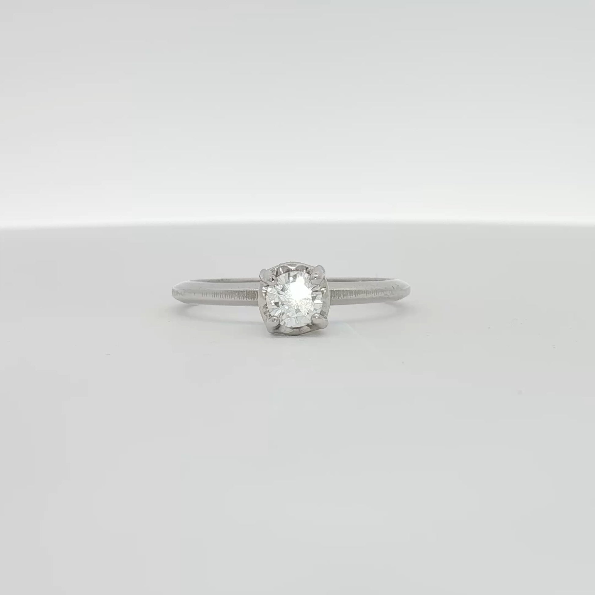14K white gold diamond solitaire ring with a single sparkling diamond set in a sleek band, stylish jewelry piece from Gold & Beyond