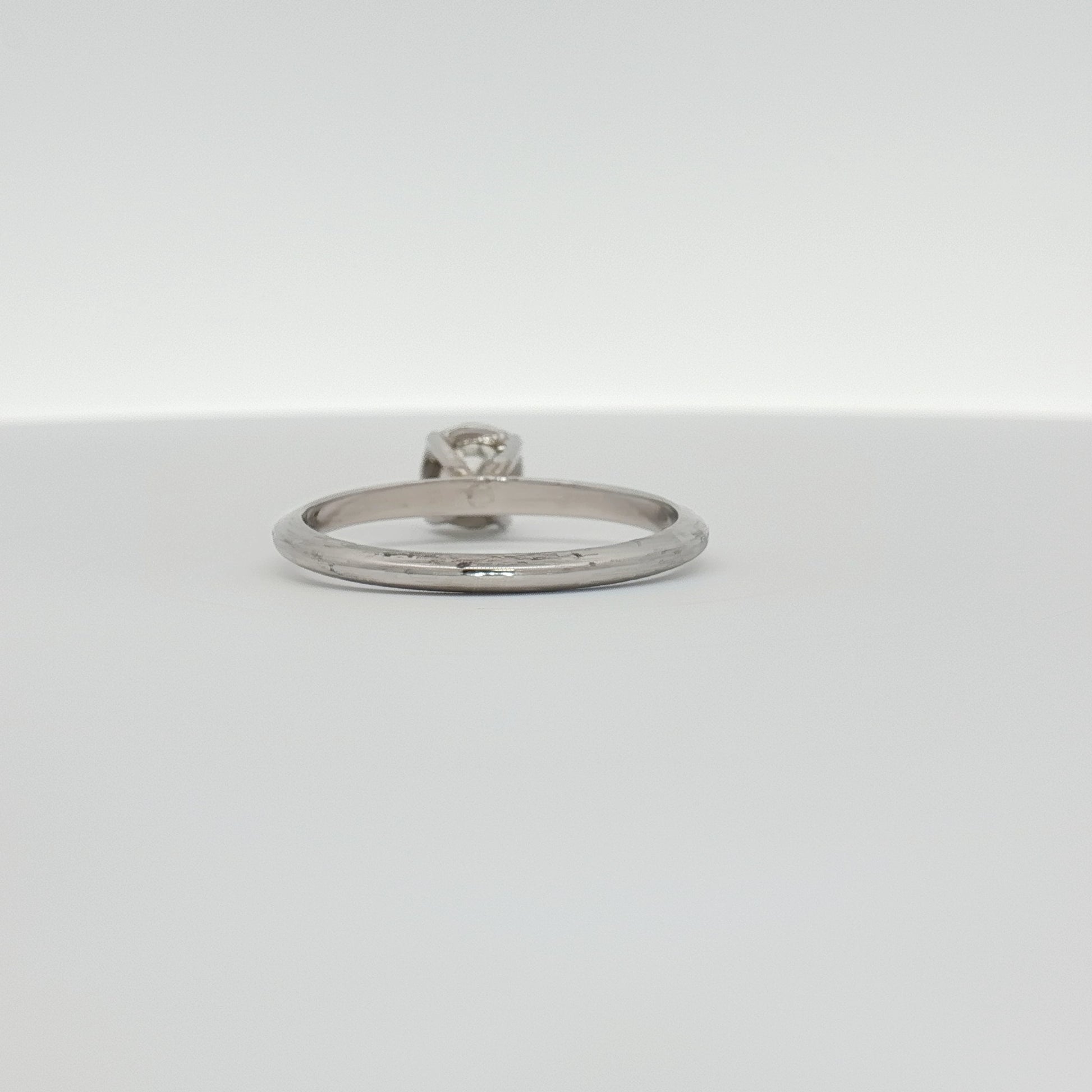14K white gold diamond solitaire ring with a single round brilliant diamond, elegant jewelry piece by Gold & Beyond.