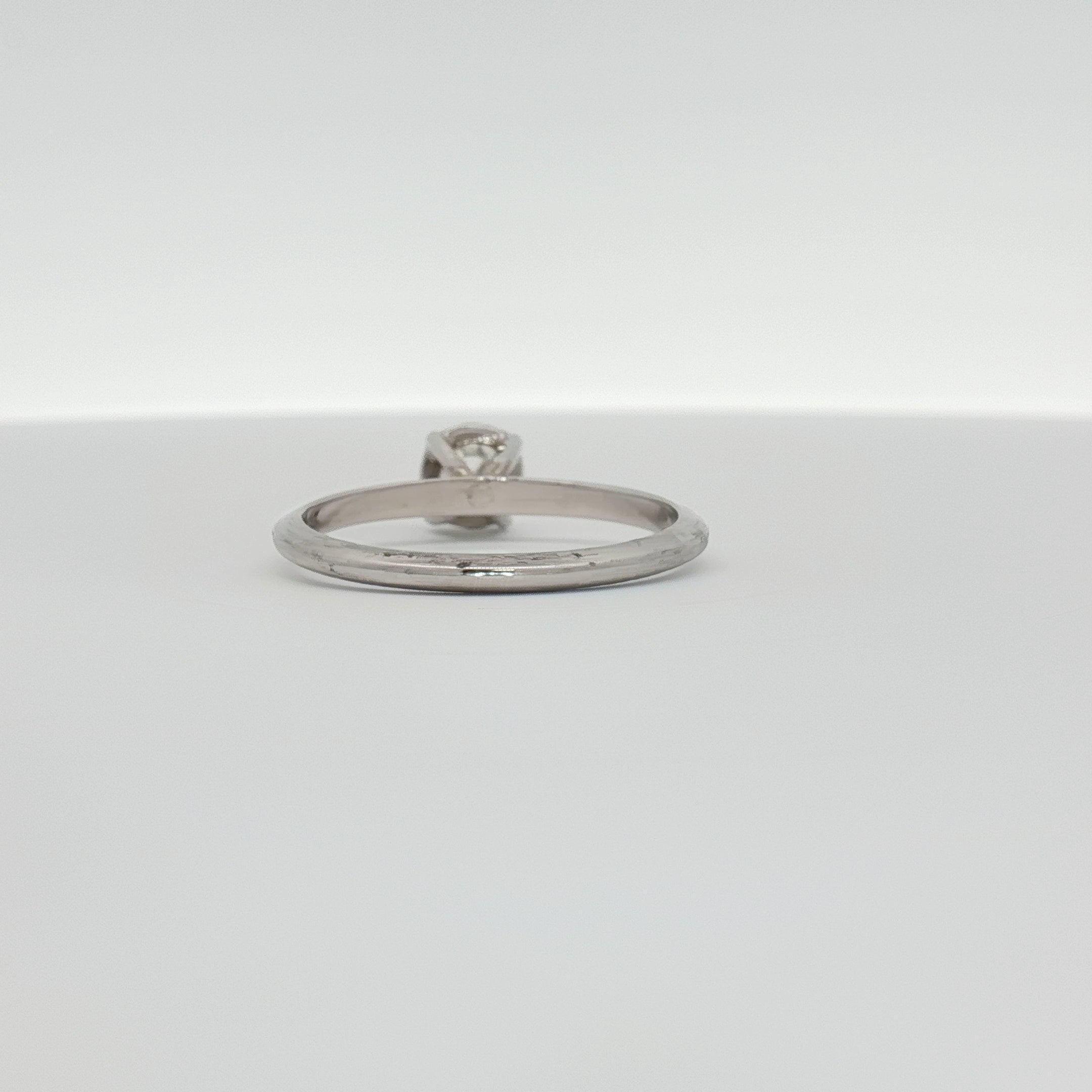 14K white gold diamond solitaire ring with a single round brilliant diamond, elegant jewelry piece by Gold & Beyond.