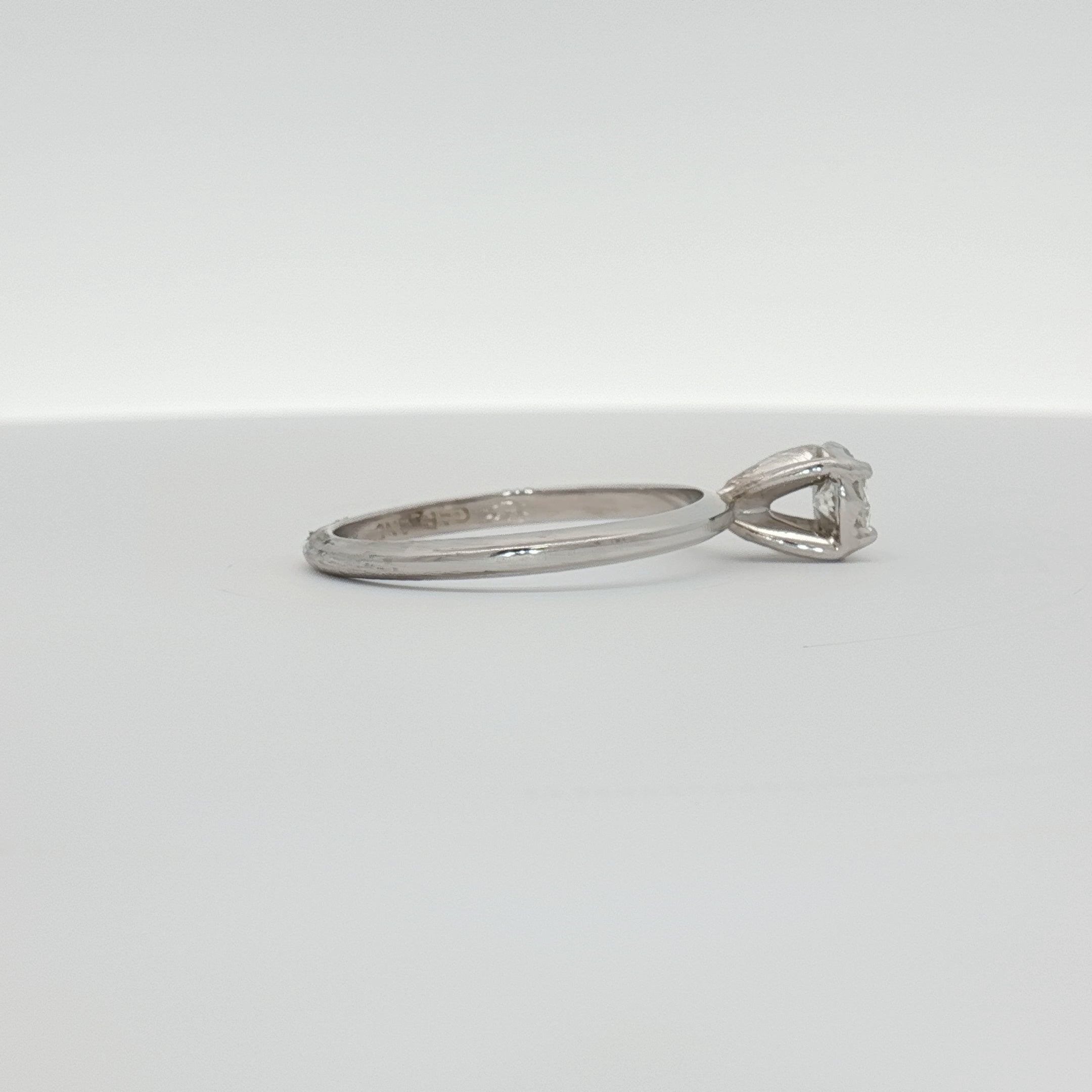 14K white gold diamond solitaire ring with a round center stone, elegant jewelry piece from Gold & Beyond.