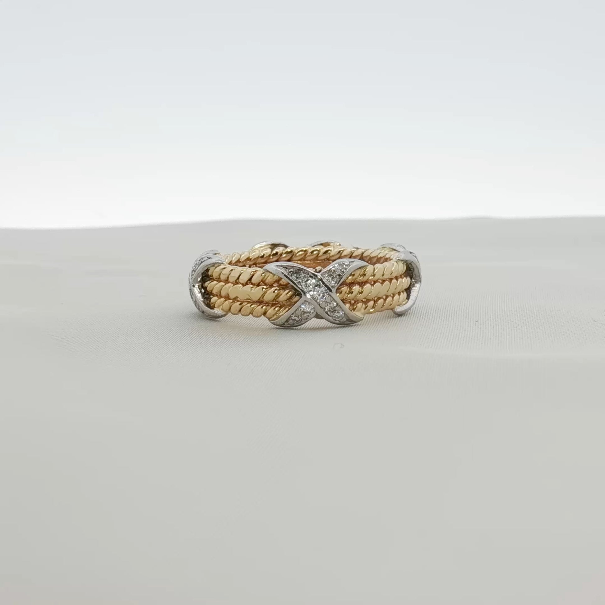 Tiffany & Co. Schlumberger three-row rope diamond ring with sparkling diamonds on gold band, elegant jewelry piece
